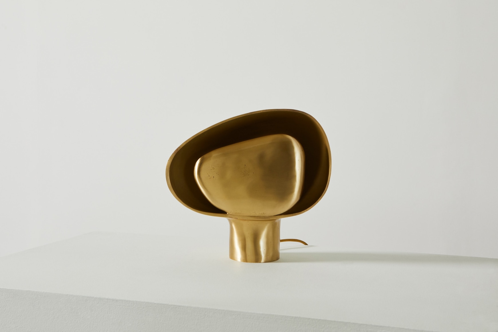Organically shaped bronze table lamp in off position