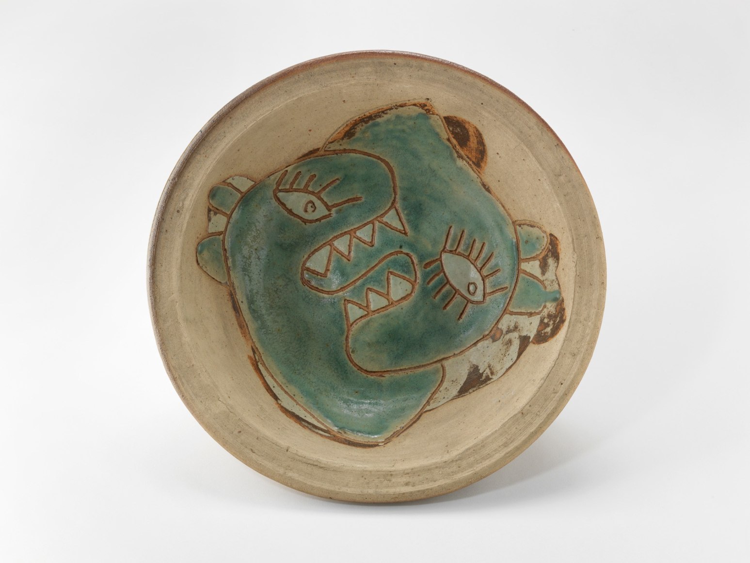 photograph of a dish in an empty room