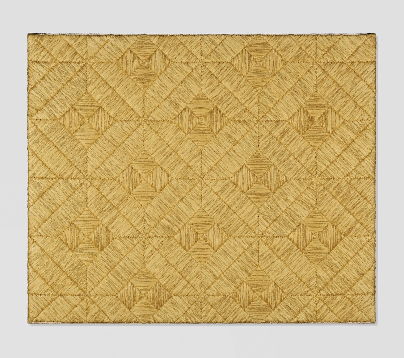 Sheila Hicks art work, threaded silk in gold. Woven in a pattern.