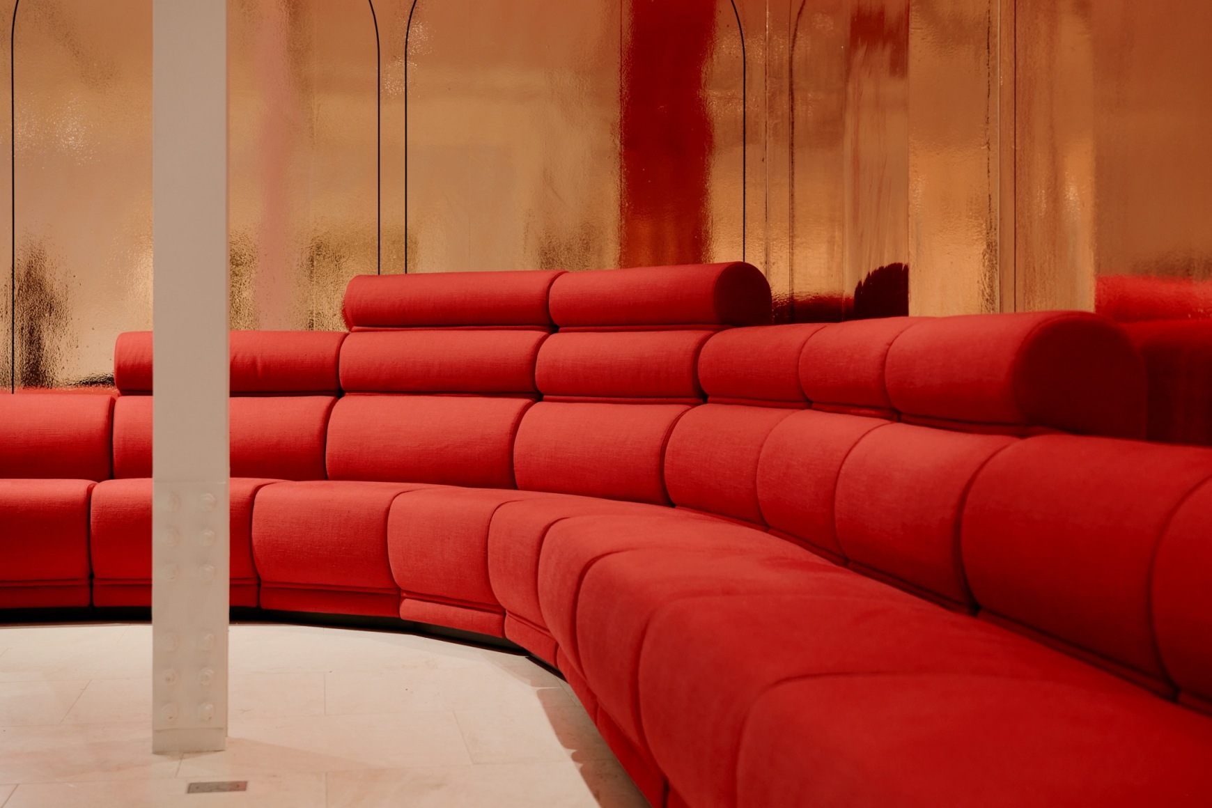 View of Paulin hotel de Ville sofa in the gallery. red upholstery in 10 sections.