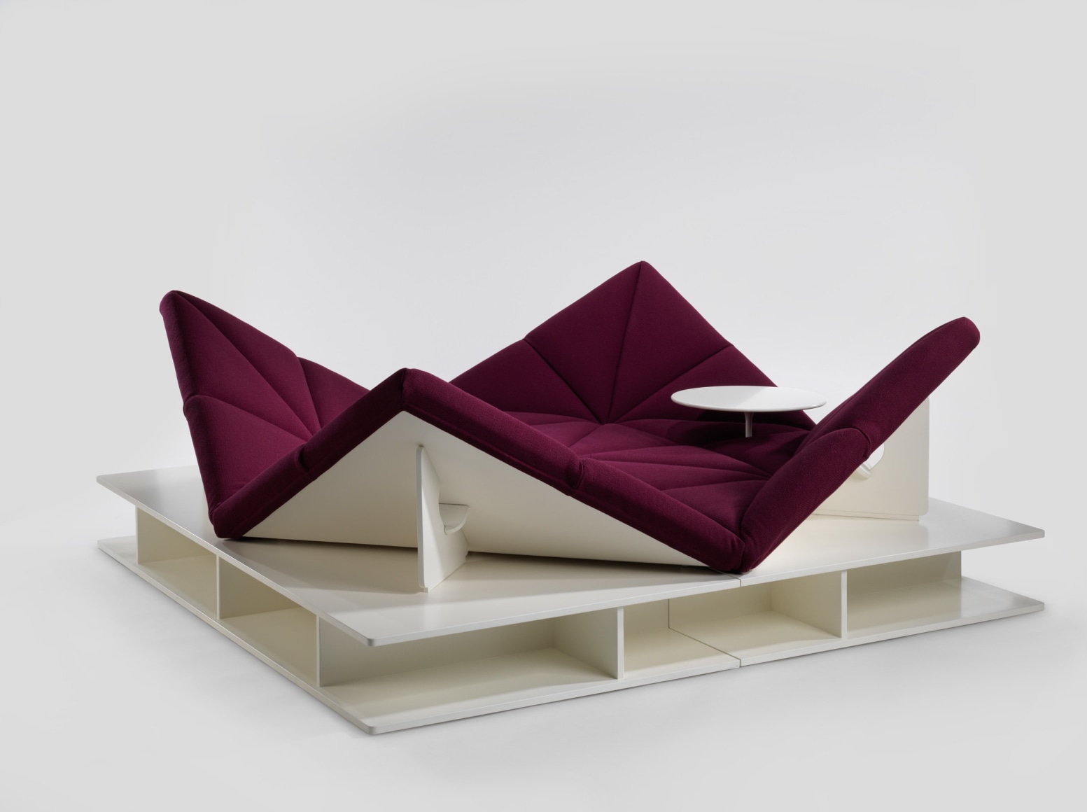 Upholstered modular sofa with removable base and table by Pierre Paulin