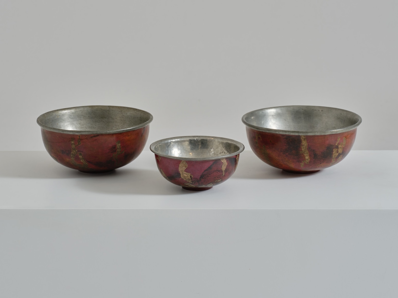 3 bowls in an empty room
