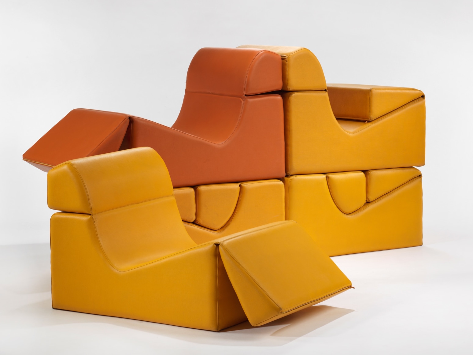 photograph in blank room with chair by Barray, chair is made from foam and vinyl