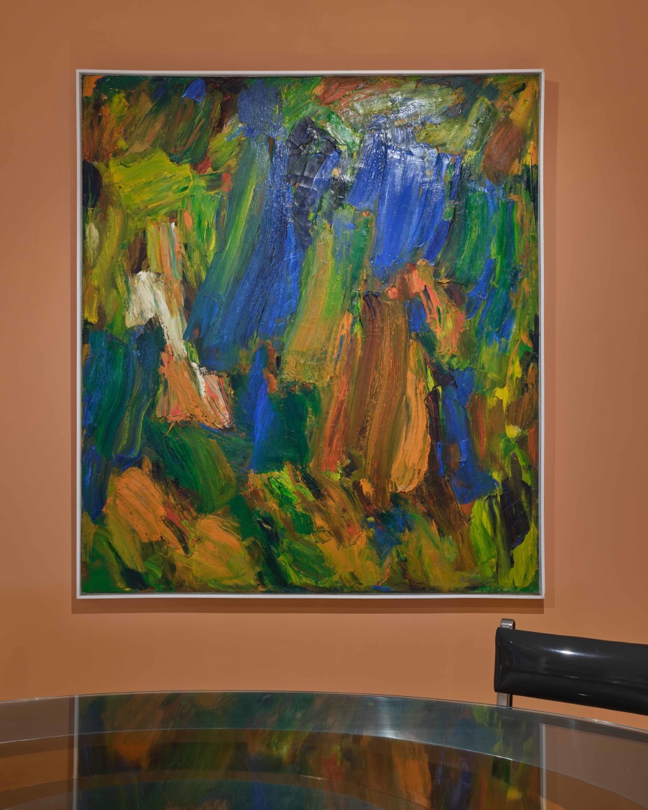 painting on an orange wall on view in an exhibition