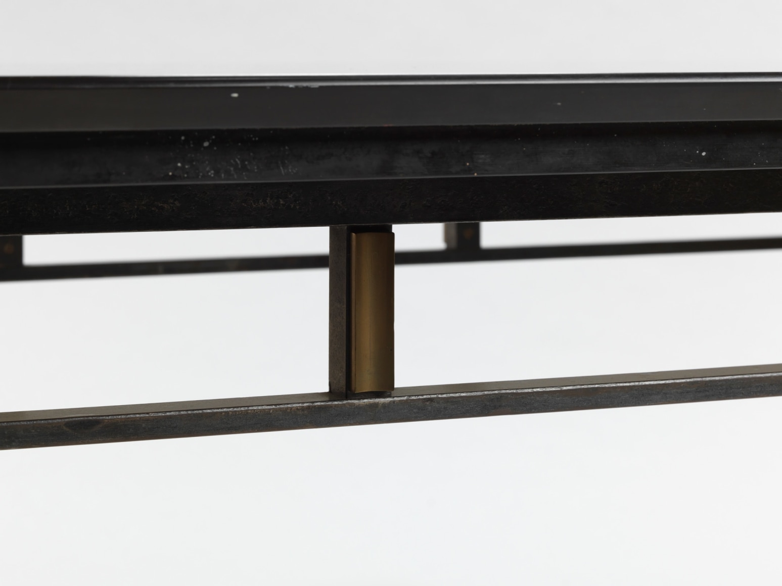 photograph of a black table in a blank room