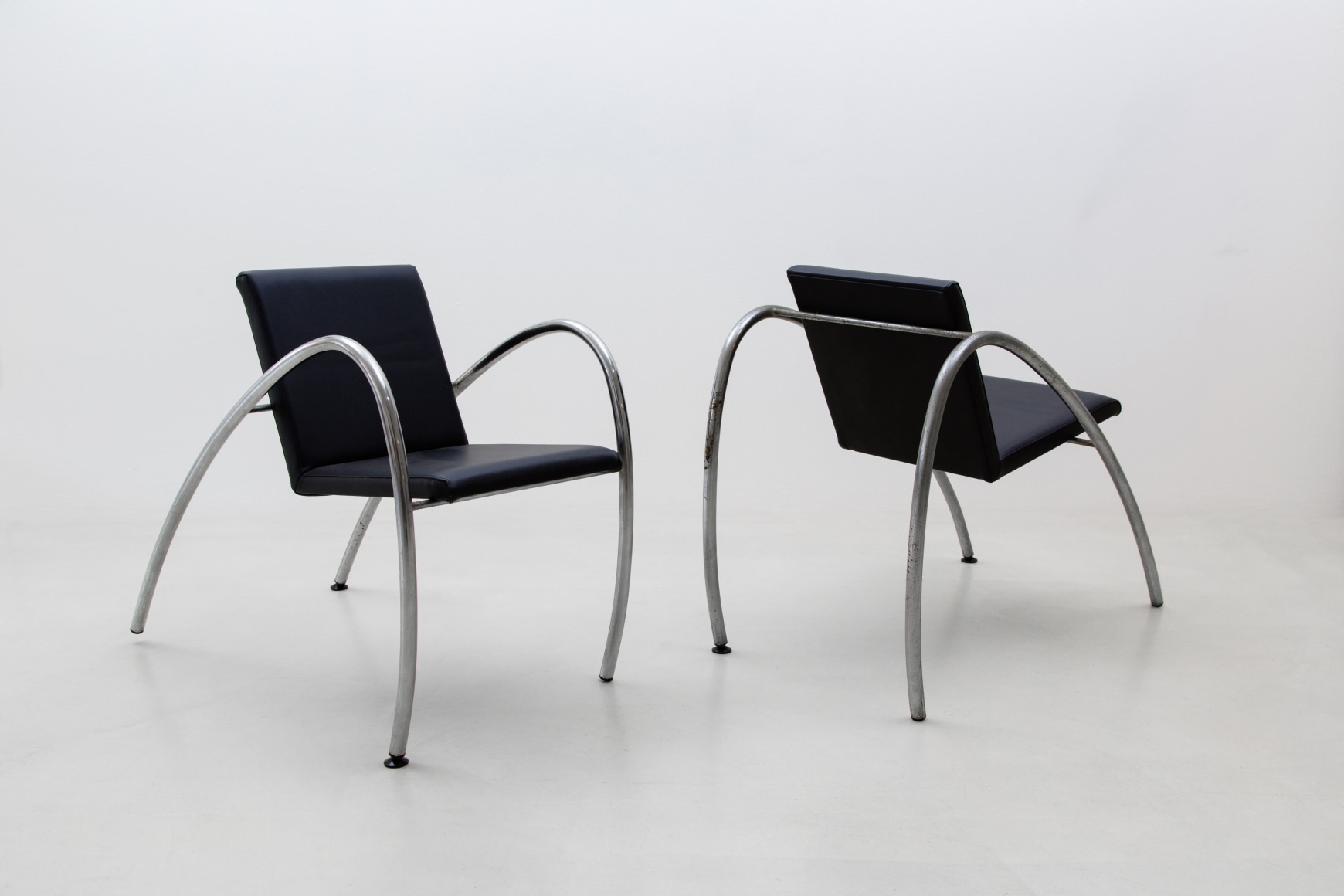 Black chairs with a white background