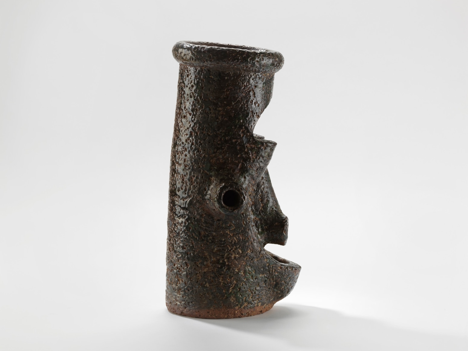 photograph of a cephalomorphic head in an empty room