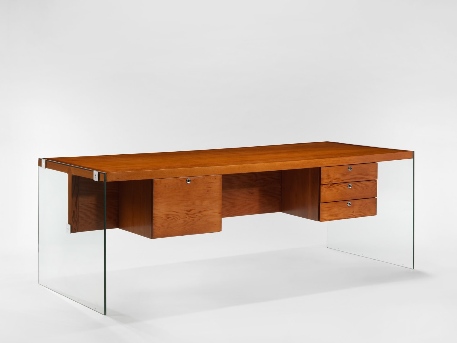 photograph of wooden desk by Motte in a blank room