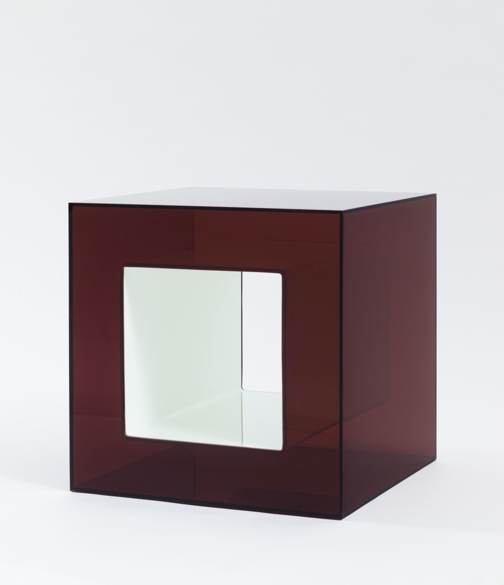 photograph of plexiglass cube in a blank room