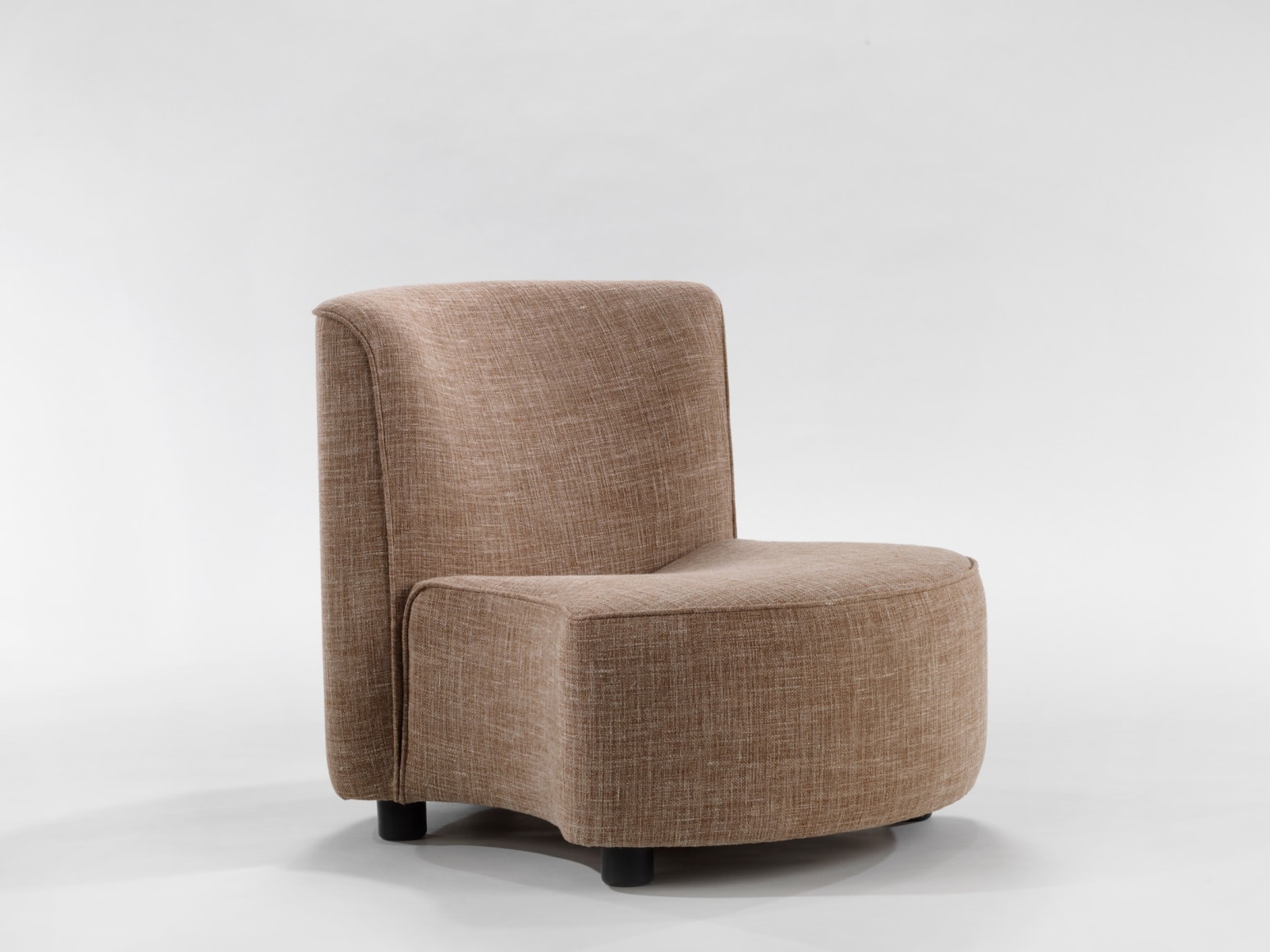 photograph of chair by Govin, chair is beige and sits low to the floor