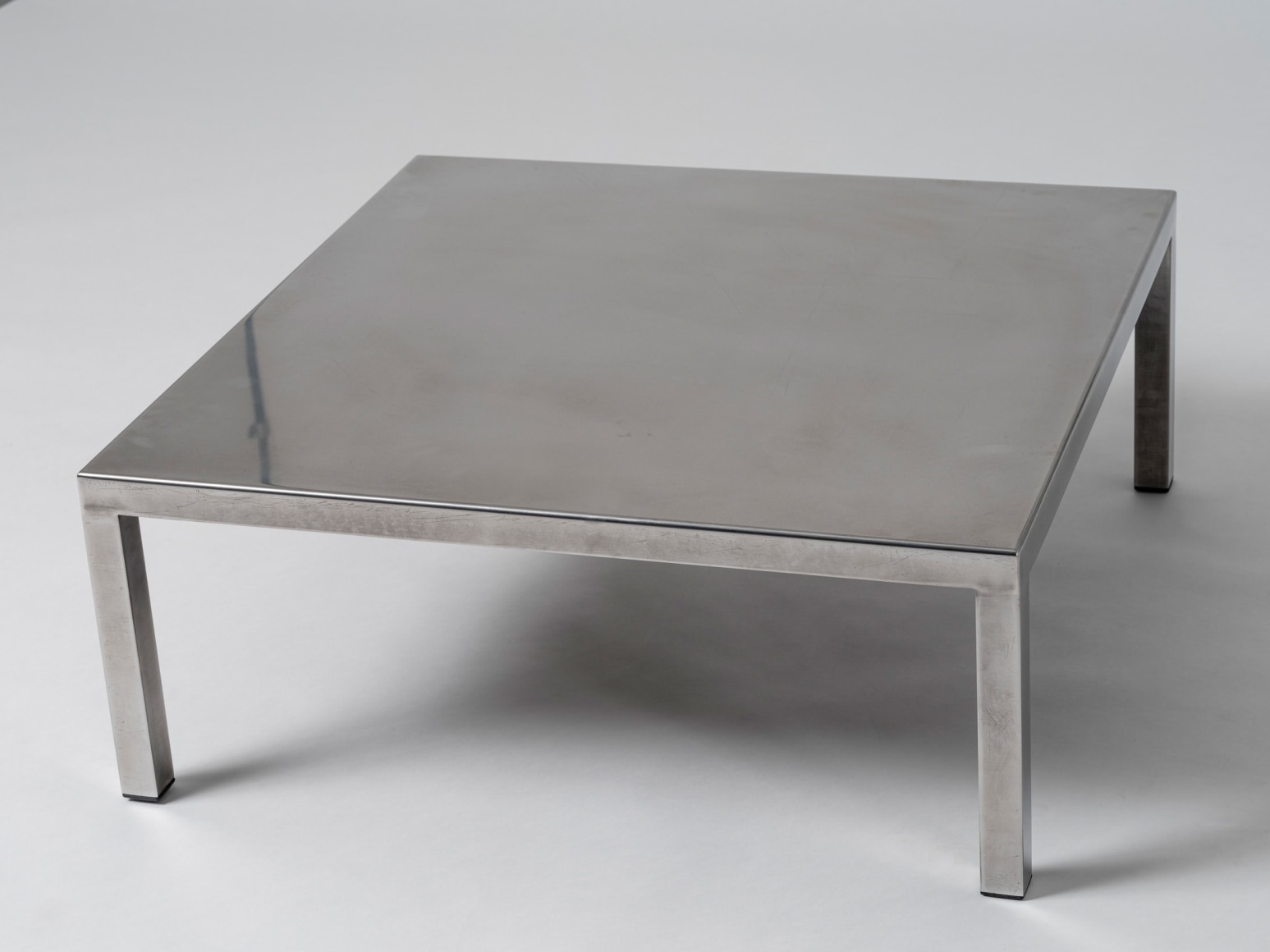 Low stainless steel table by Maria Pergay