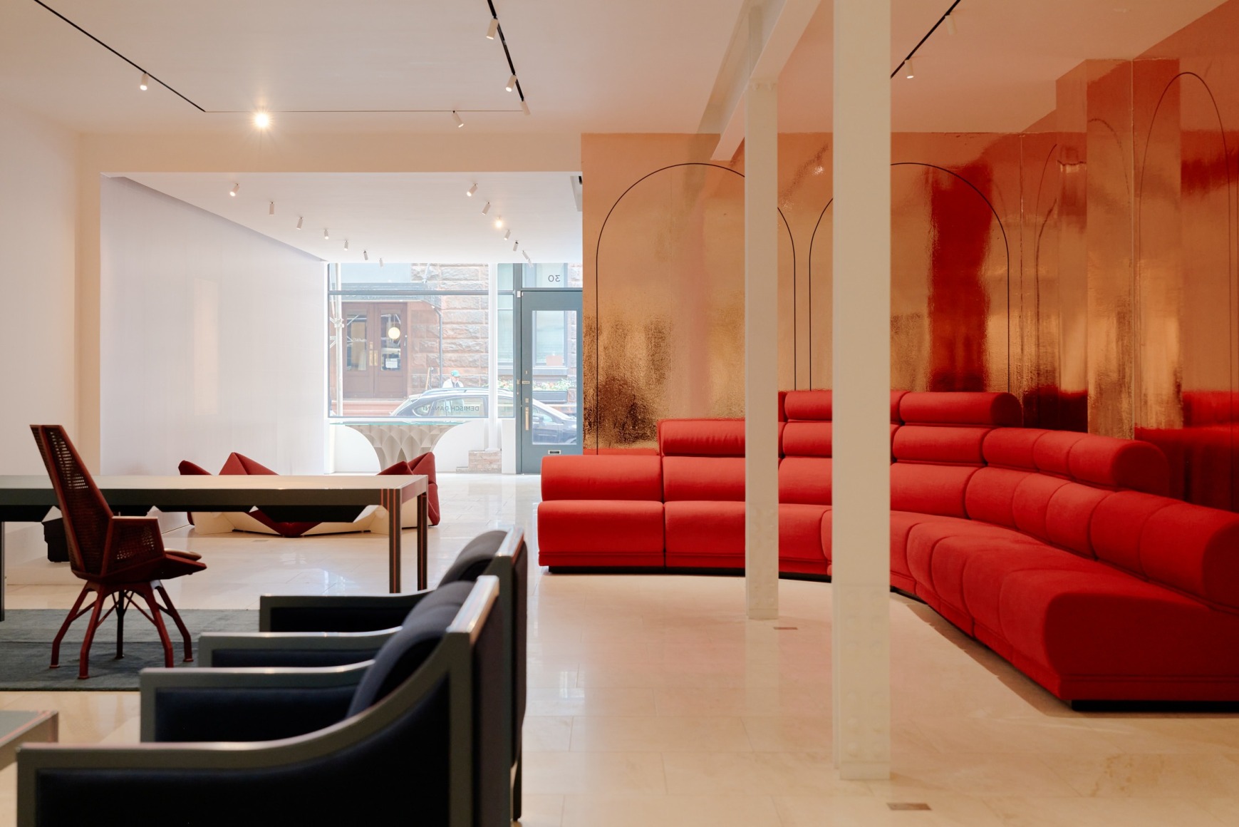 View of Paulin hotel de Ville sofa in the gallery. red upholstery in 10 sections.