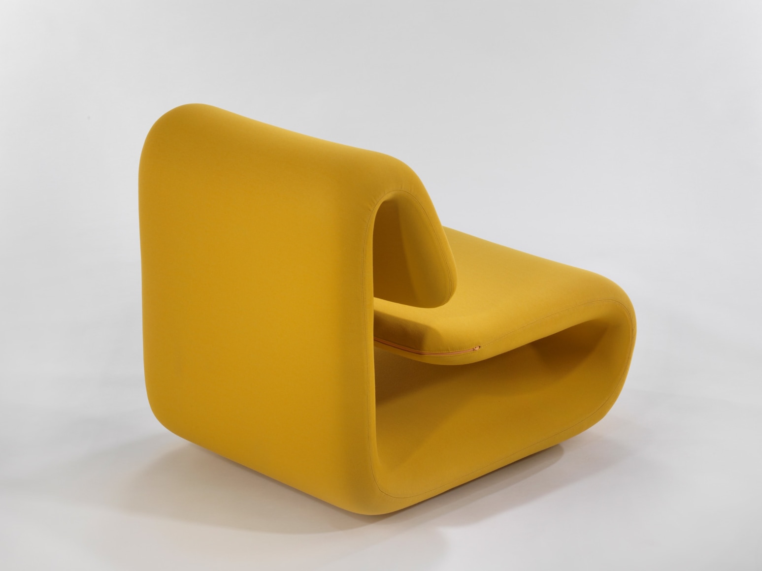 yellow chair in a blank room