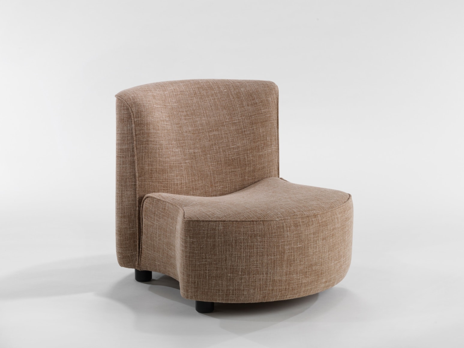 photograph of chair by Govin, chair is beige and sits low to the floor