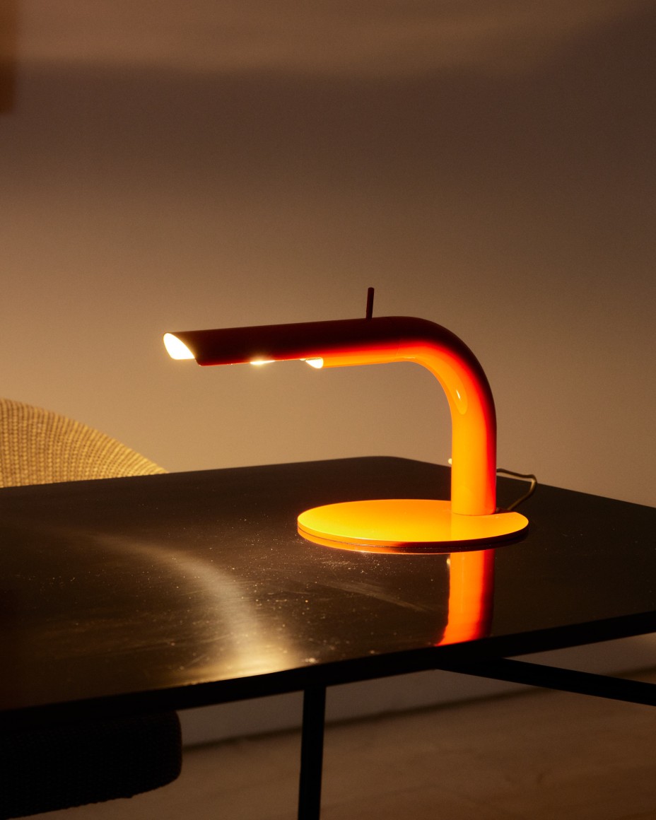 Low lit orange metal desk lamp by Alain Richard