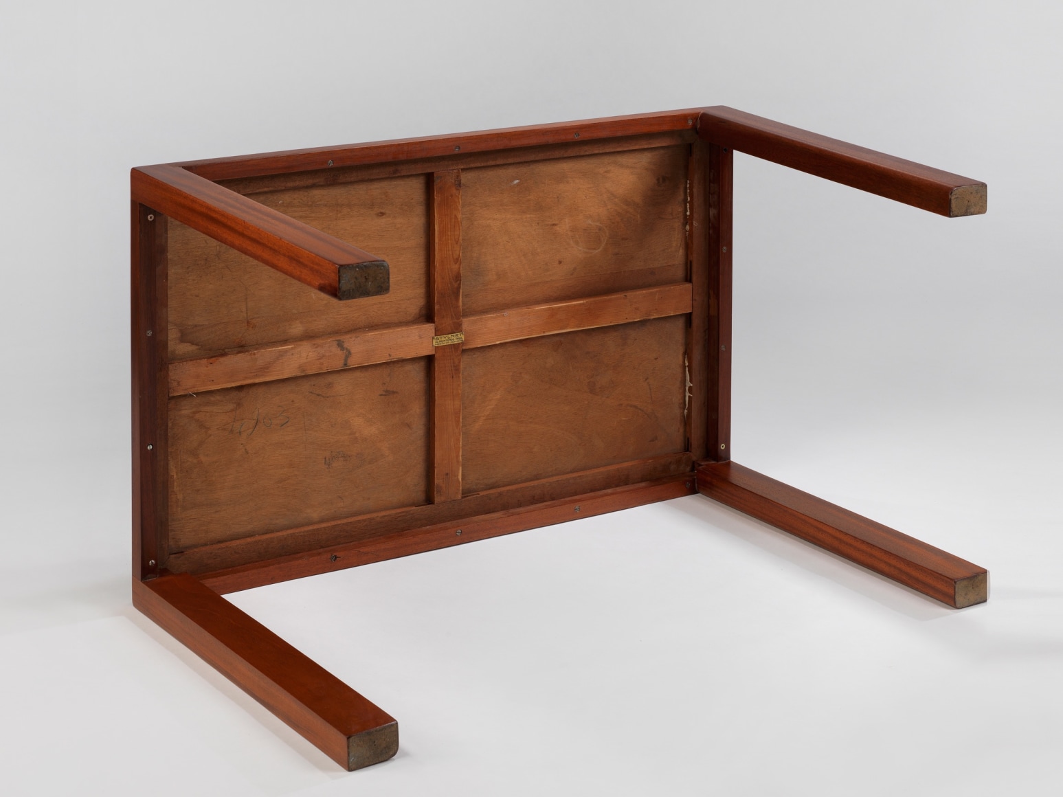 Underside of wooden table