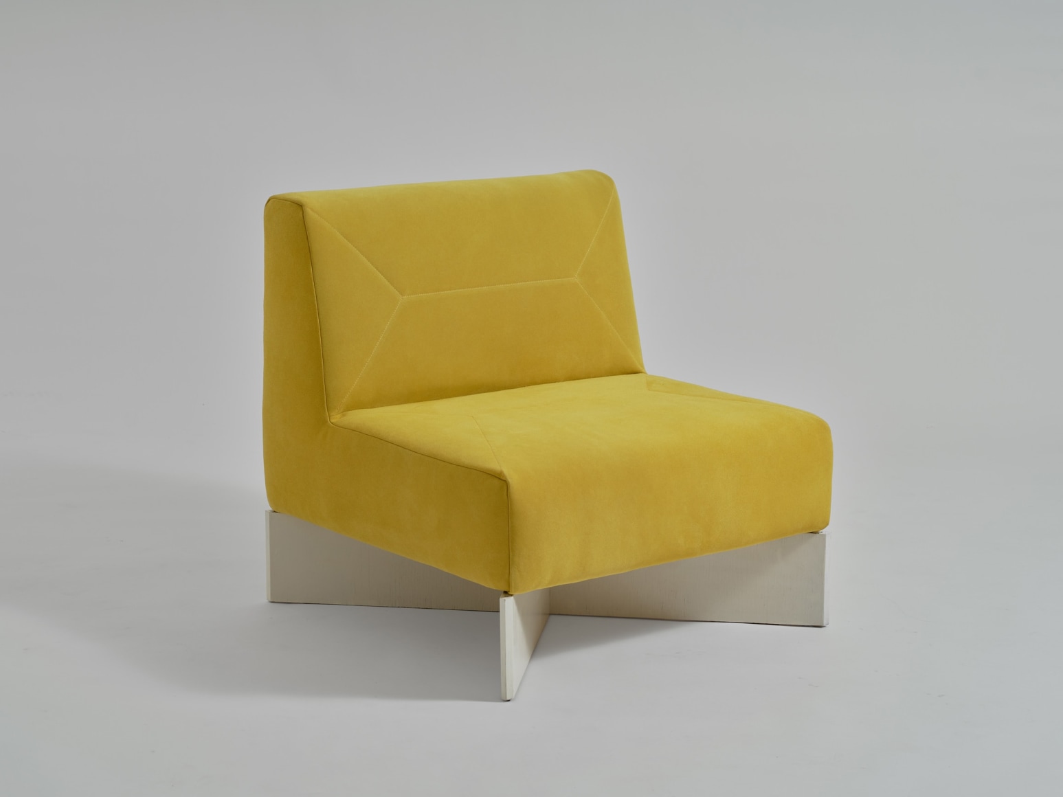 yellow chair in an empty room