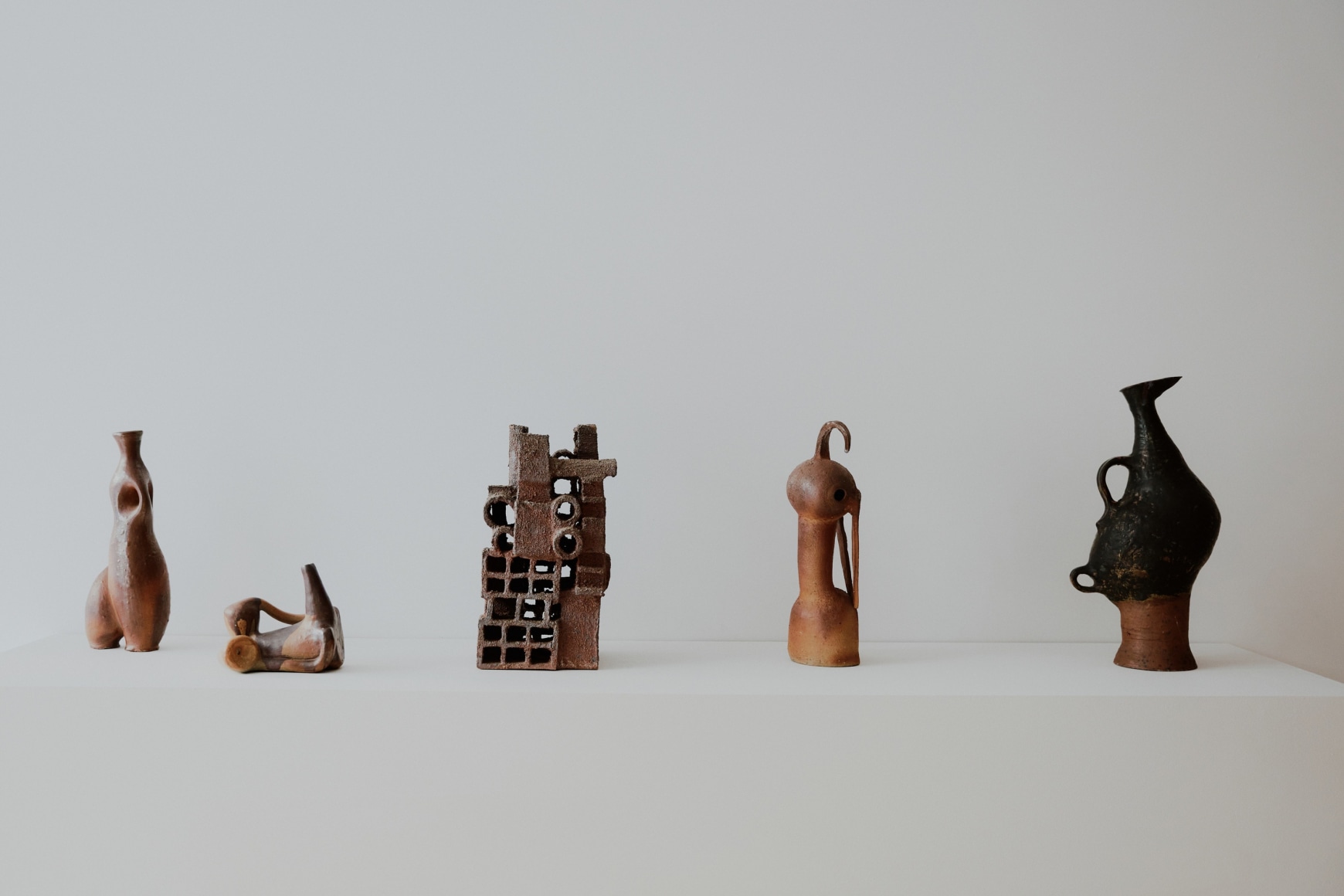 Installation view of works in the gallery, mostly furniture and some rugs and art.