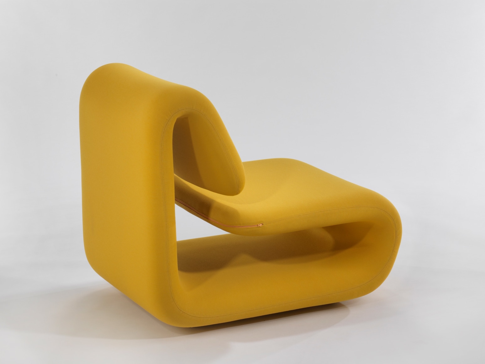 yellow chair in a blank room
