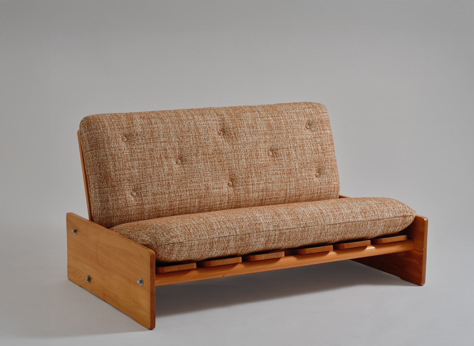 mcm sofa in an empty room