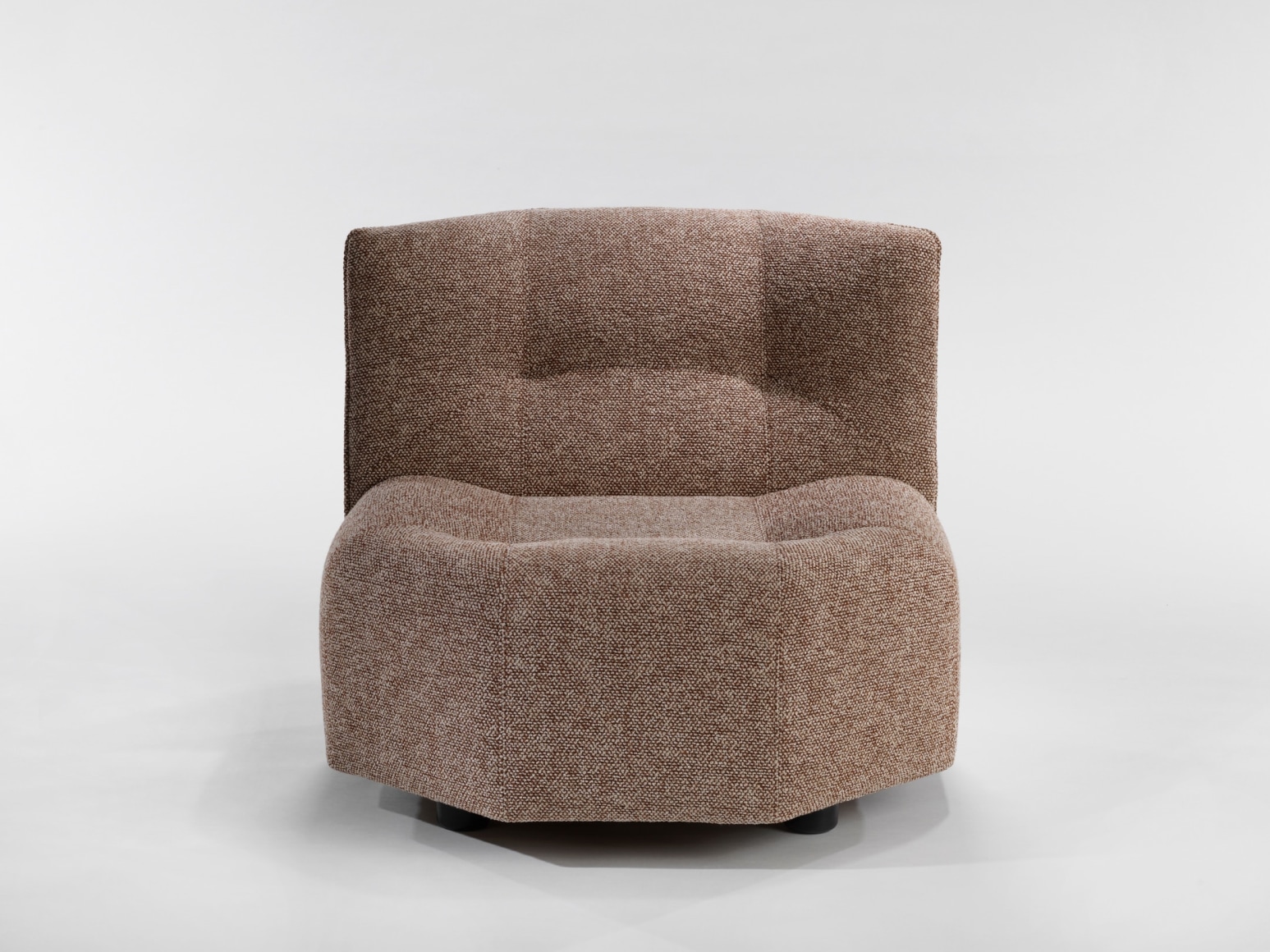 photograph of a chair by Govin in a blank room, chair is brown and has no arms