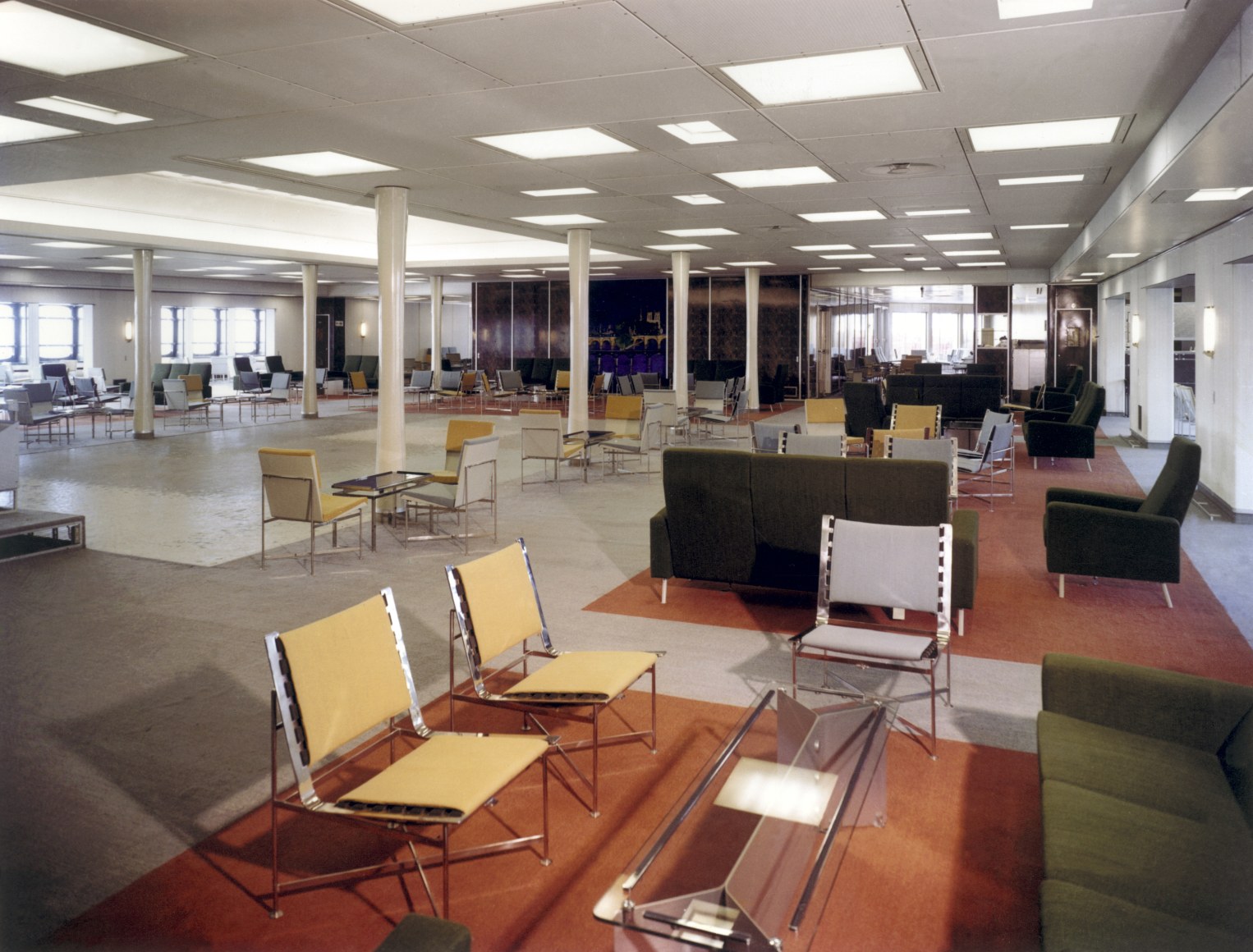 Archival photo of Jacques Dumond Low Chairs, 1961 in a grand room on the SS France 1961