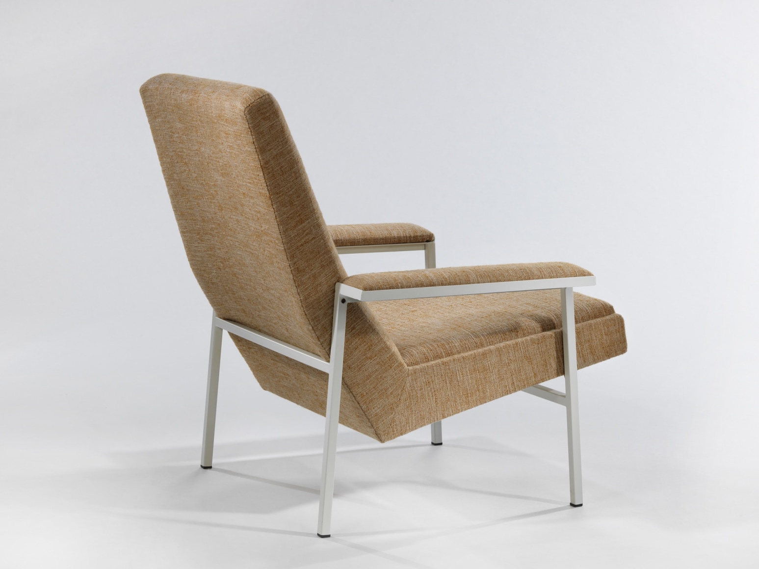 Back of upholstered armchair by A.R.P.