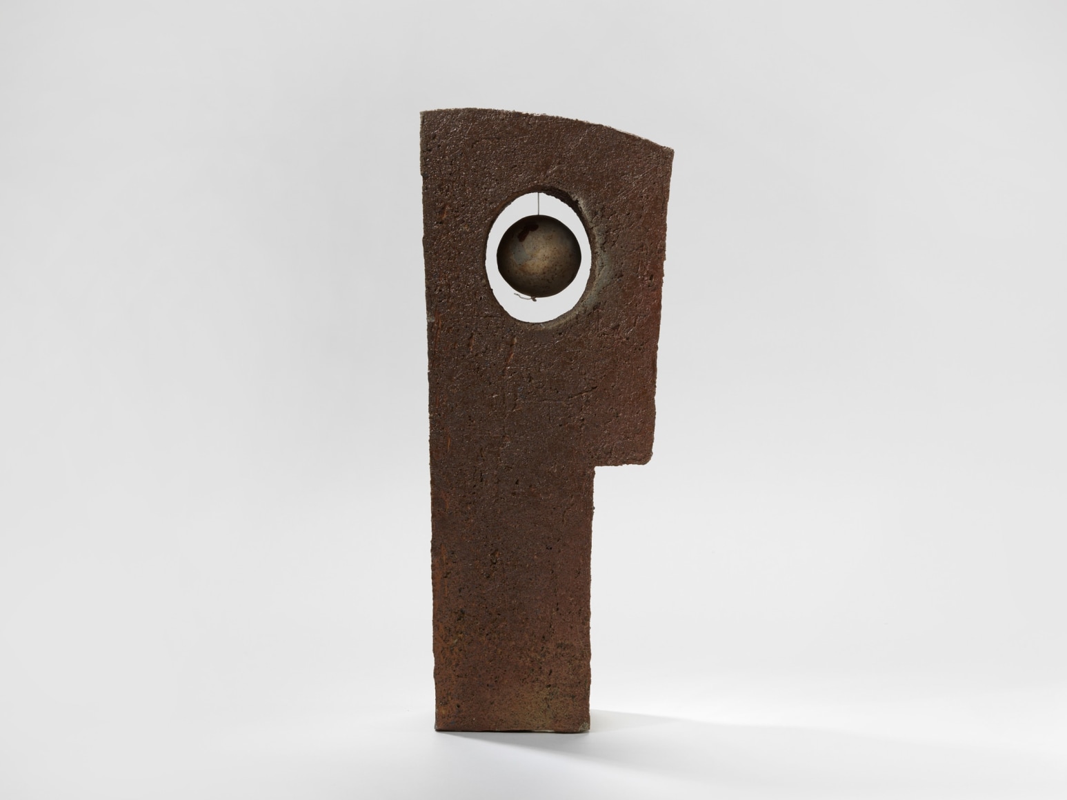 photograph of geometric sculpture in an empty room