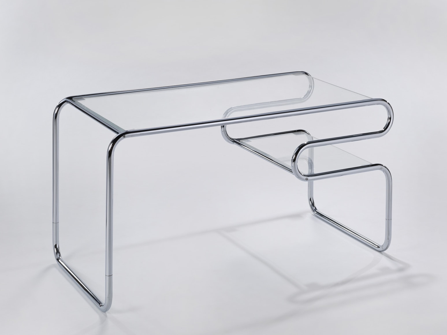 Chrome tubular glass topped desk by Michel Hamon