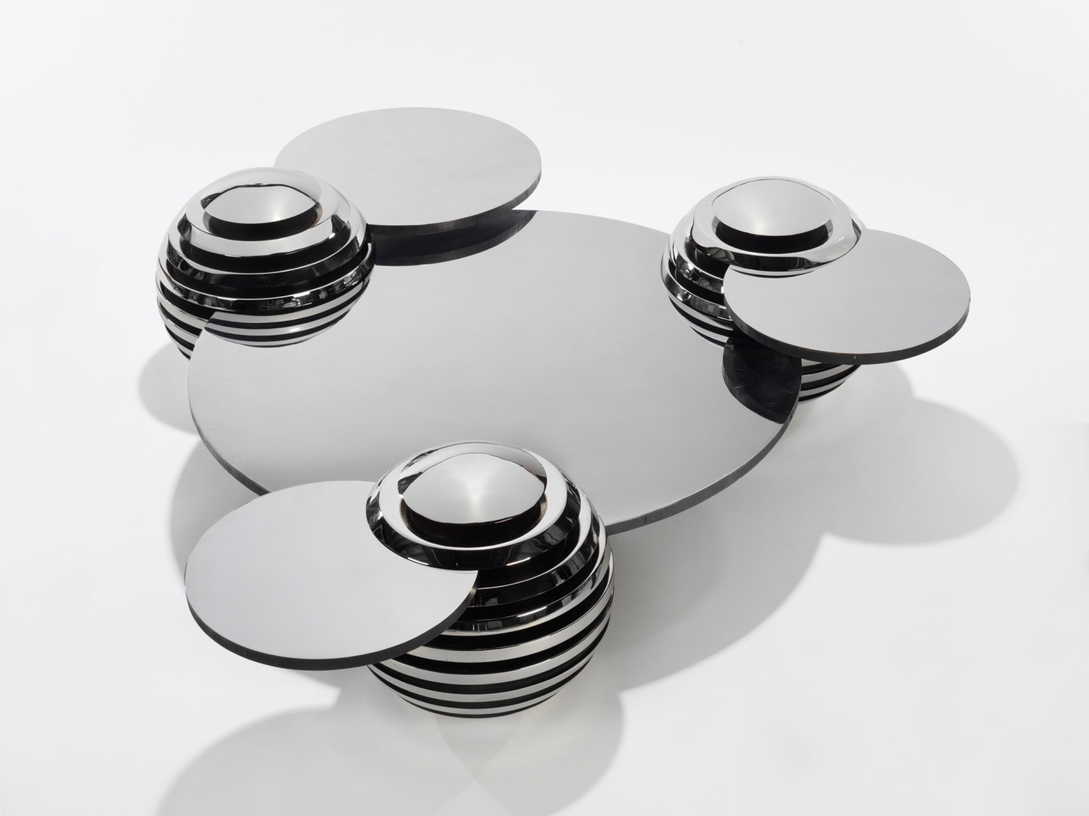 Steel and metal table by Mansau in a blank room