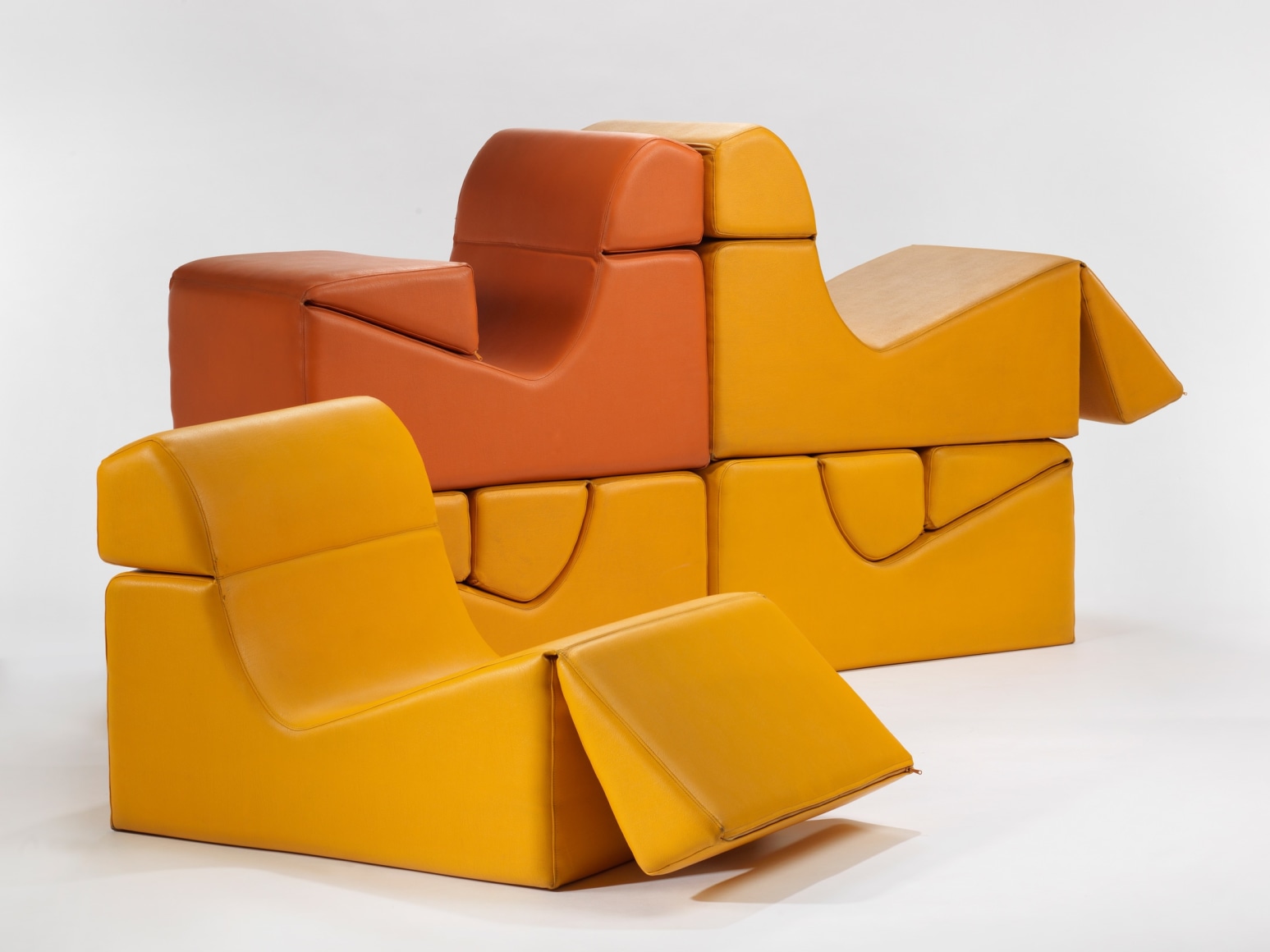 photograph in blank room with chair by Barray, chair is made from foam and vinyl