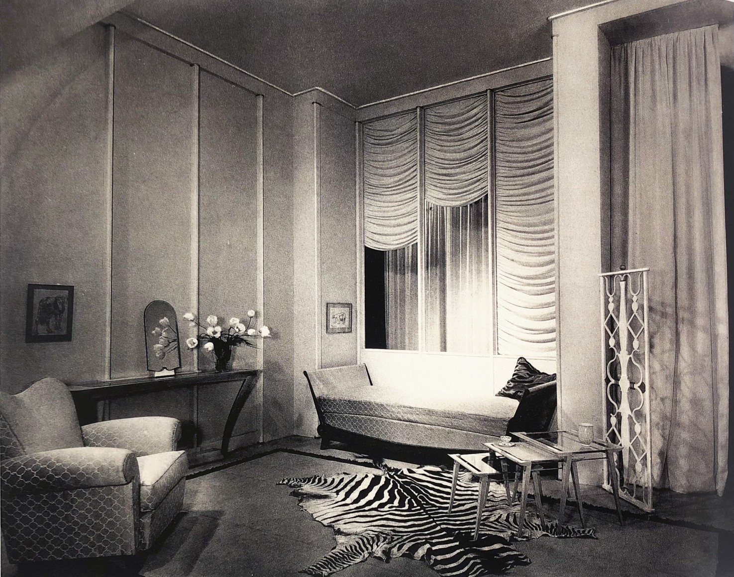 archival image of SAD booth with club chair by Maxime Old.