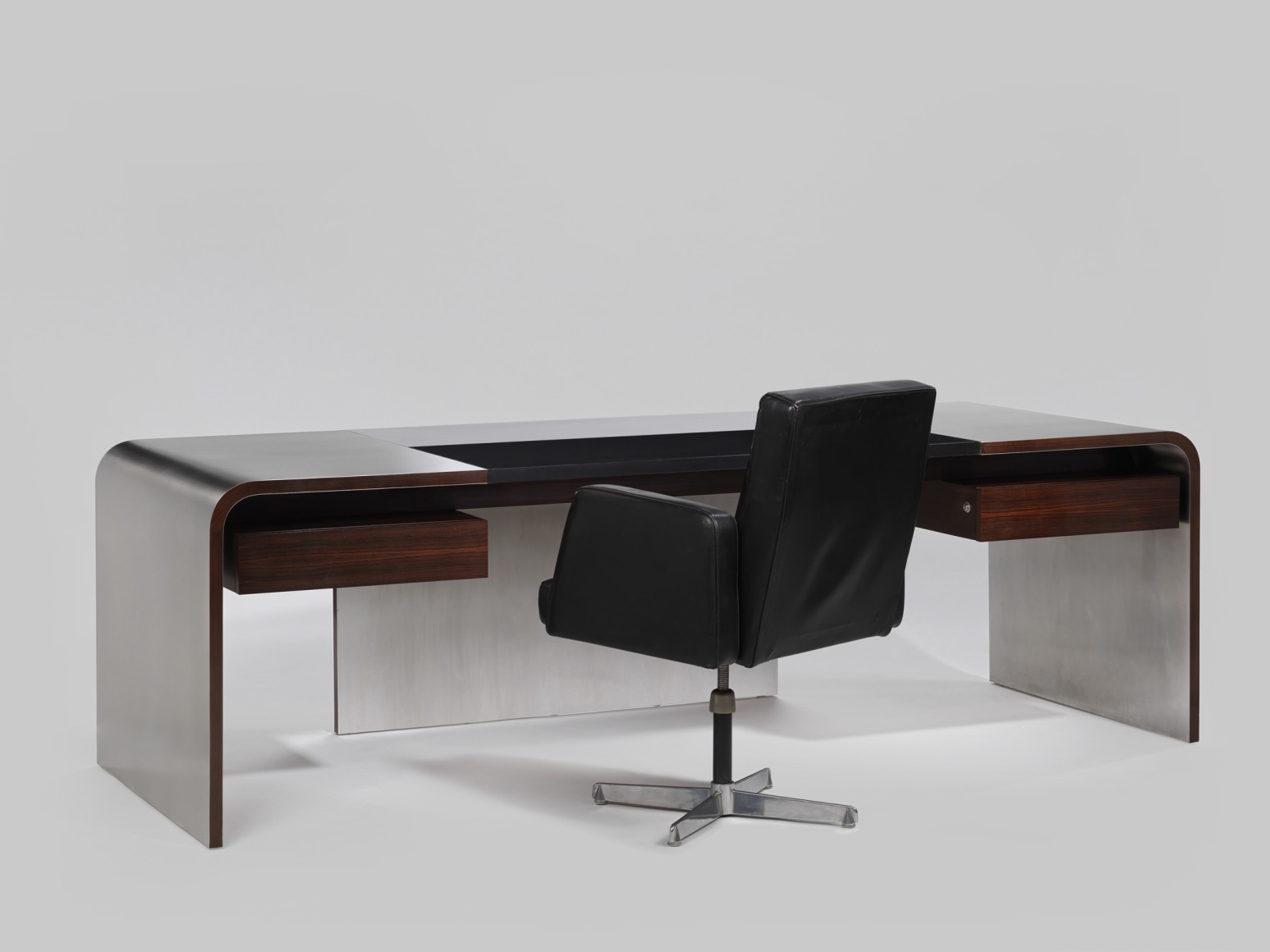 View of stainless steel desk with wooden drawers with desk chair