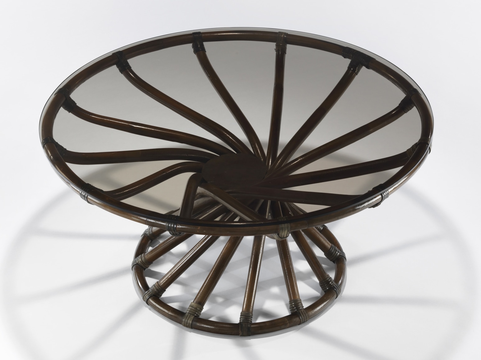 Glass topped rattan low table by Bernard Govin