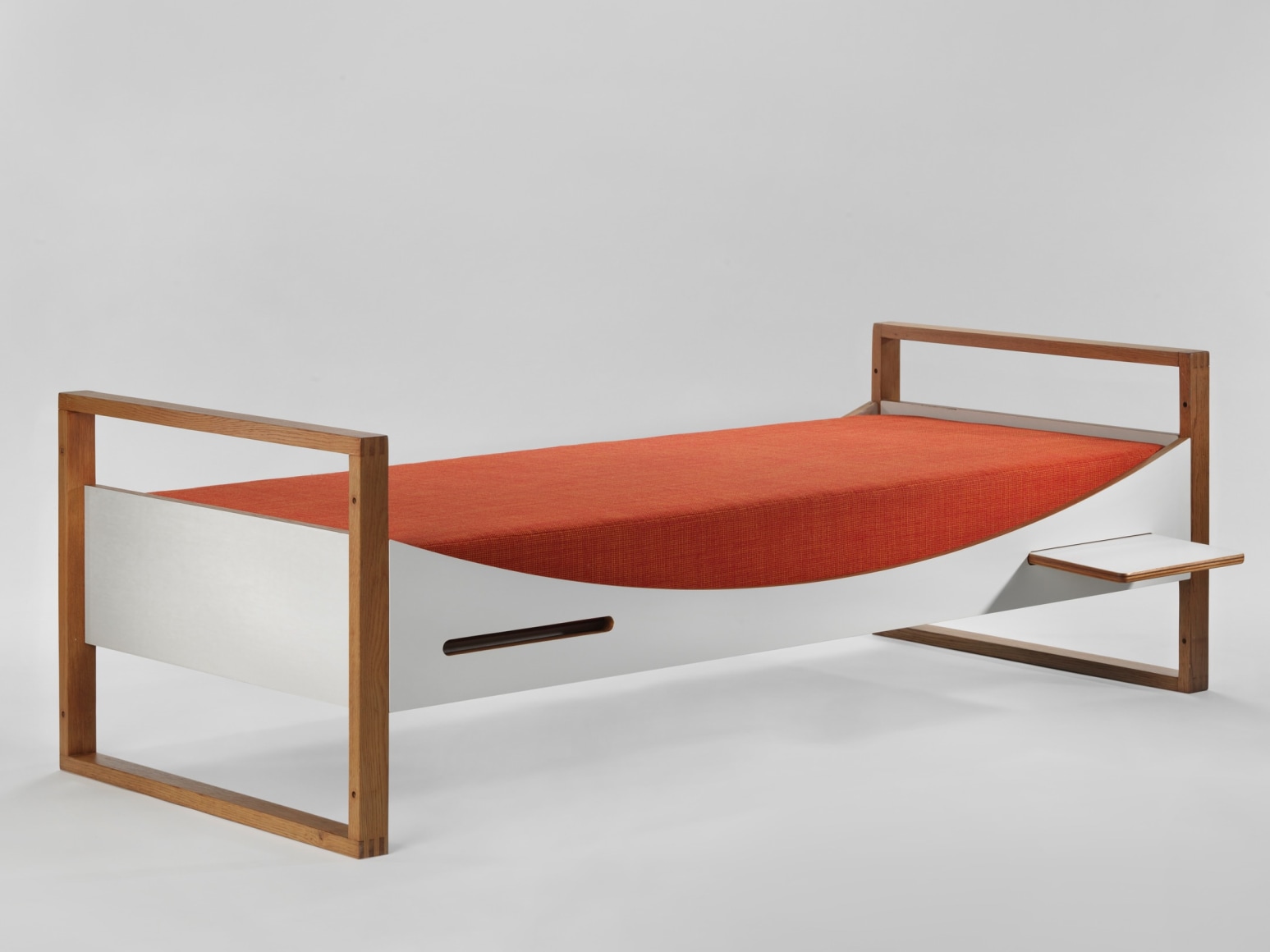 midcentury bed in an empty room