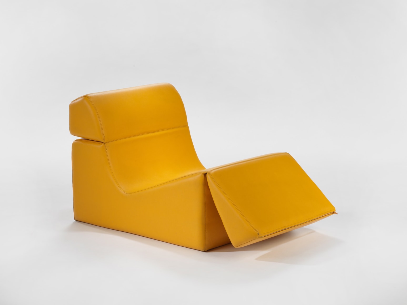 photograph in blank room with chair by Barray, chair is made from foam and vinyl