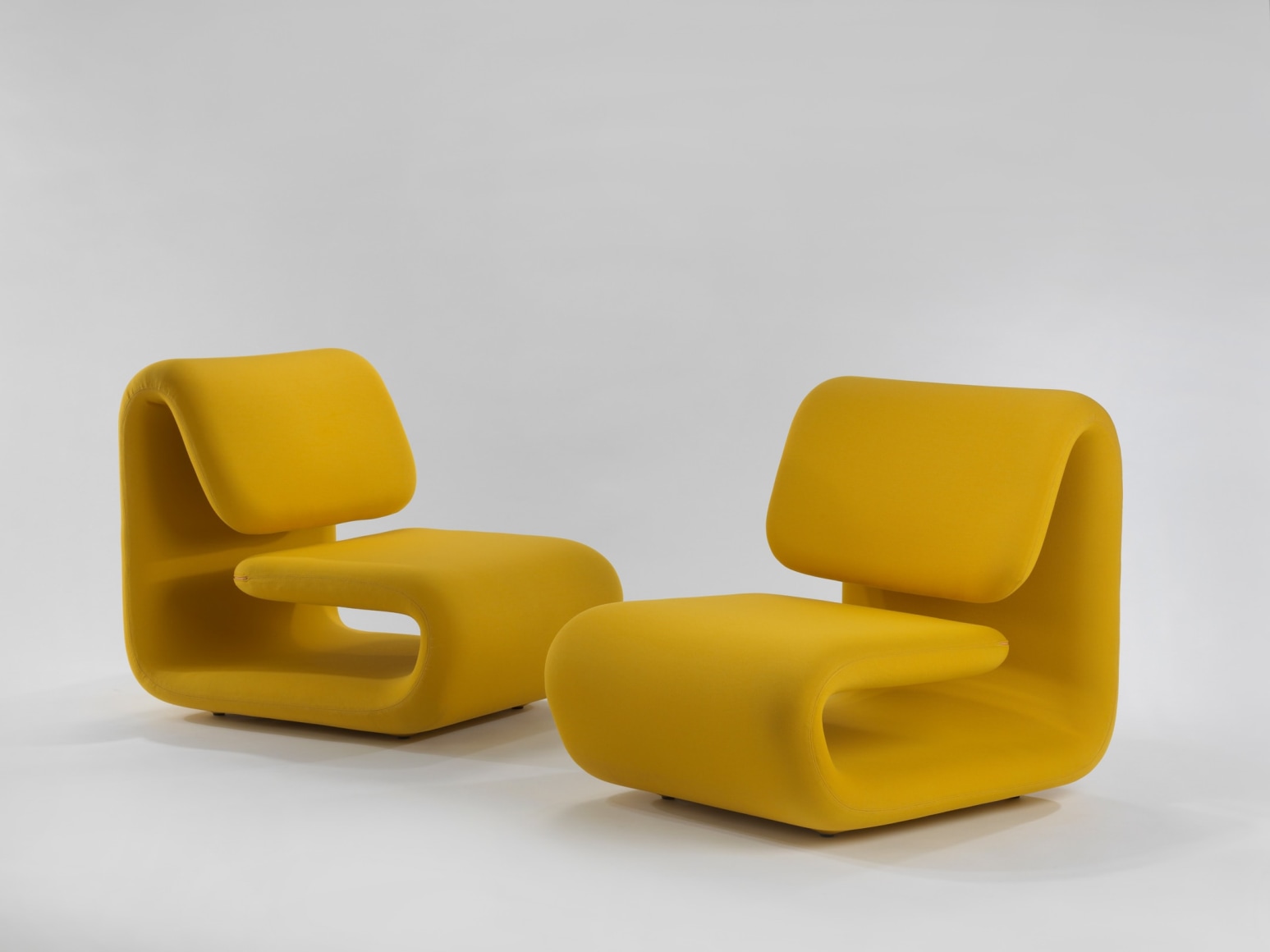 yellow chair in a blank room
