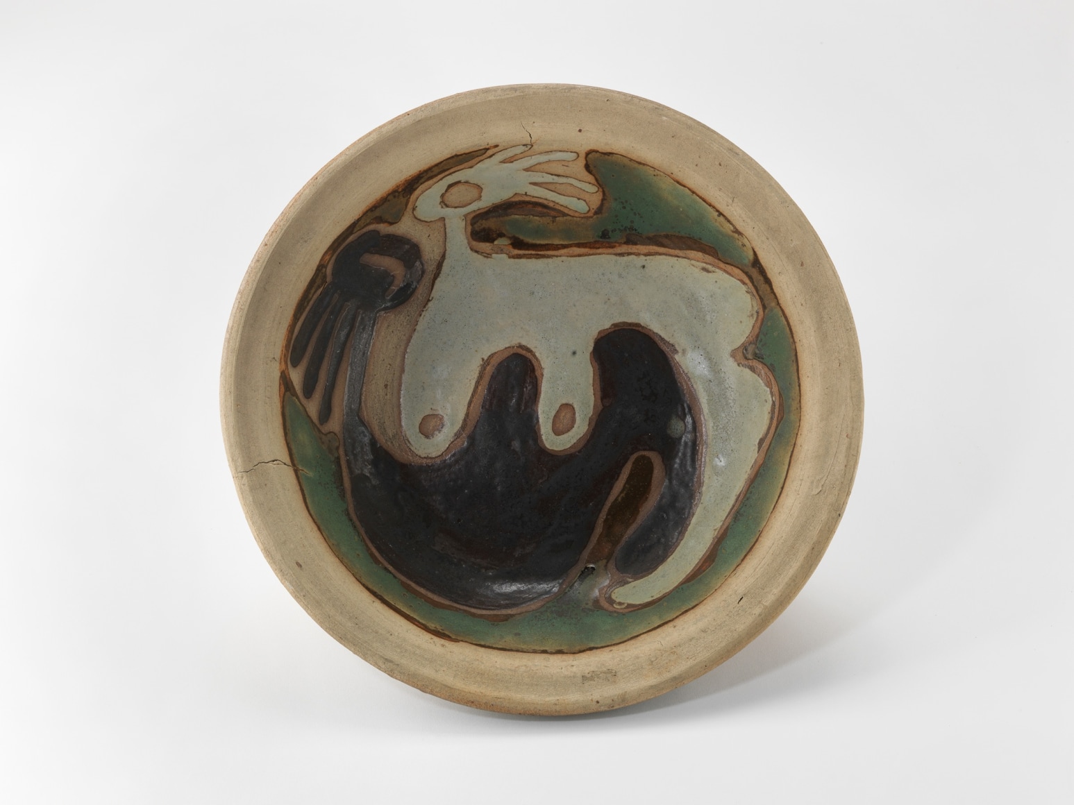 photograph of a dish in an empty room