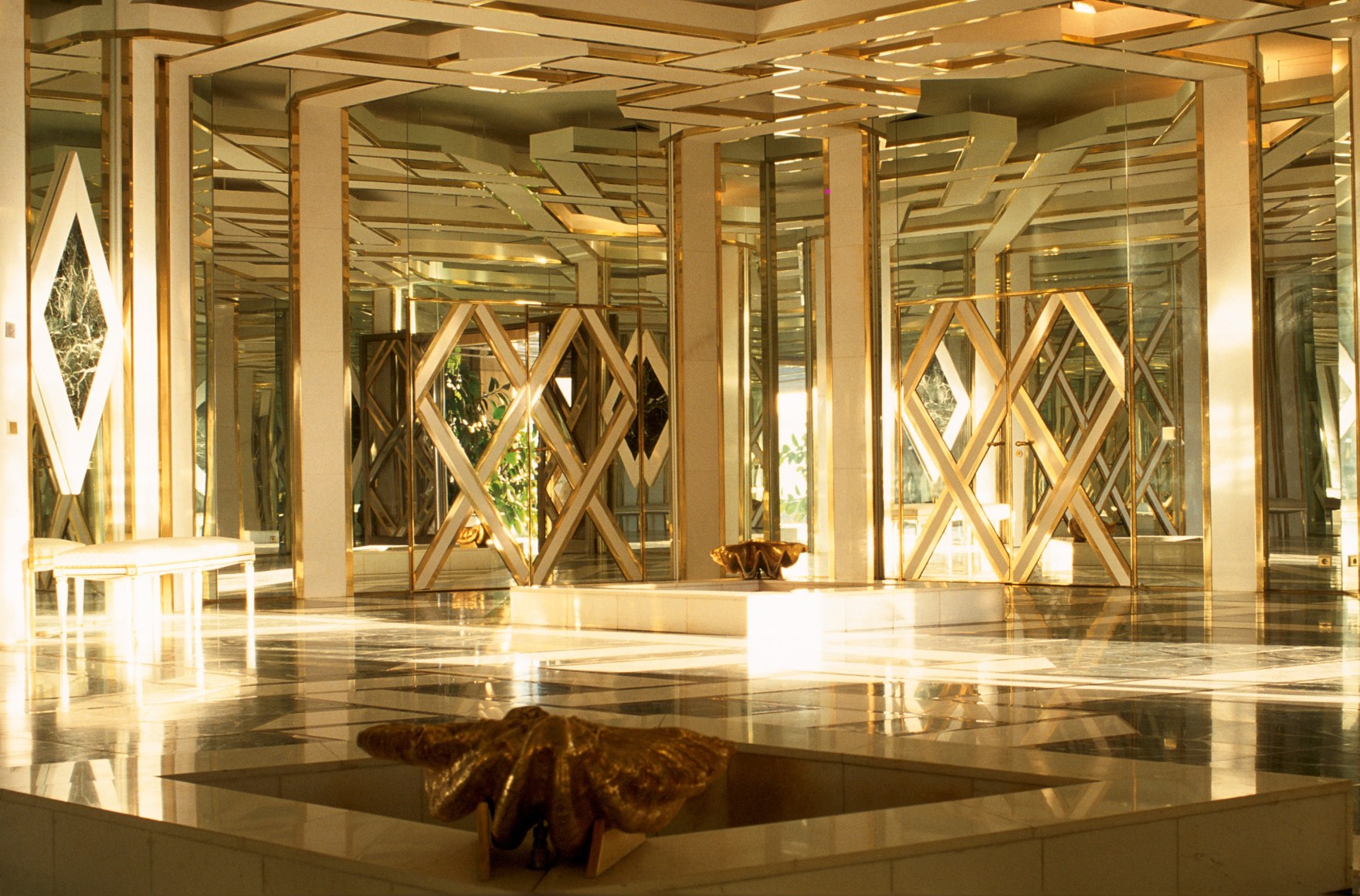 A mirrored hall designed featuring a large oyster shell by Maria Pergay