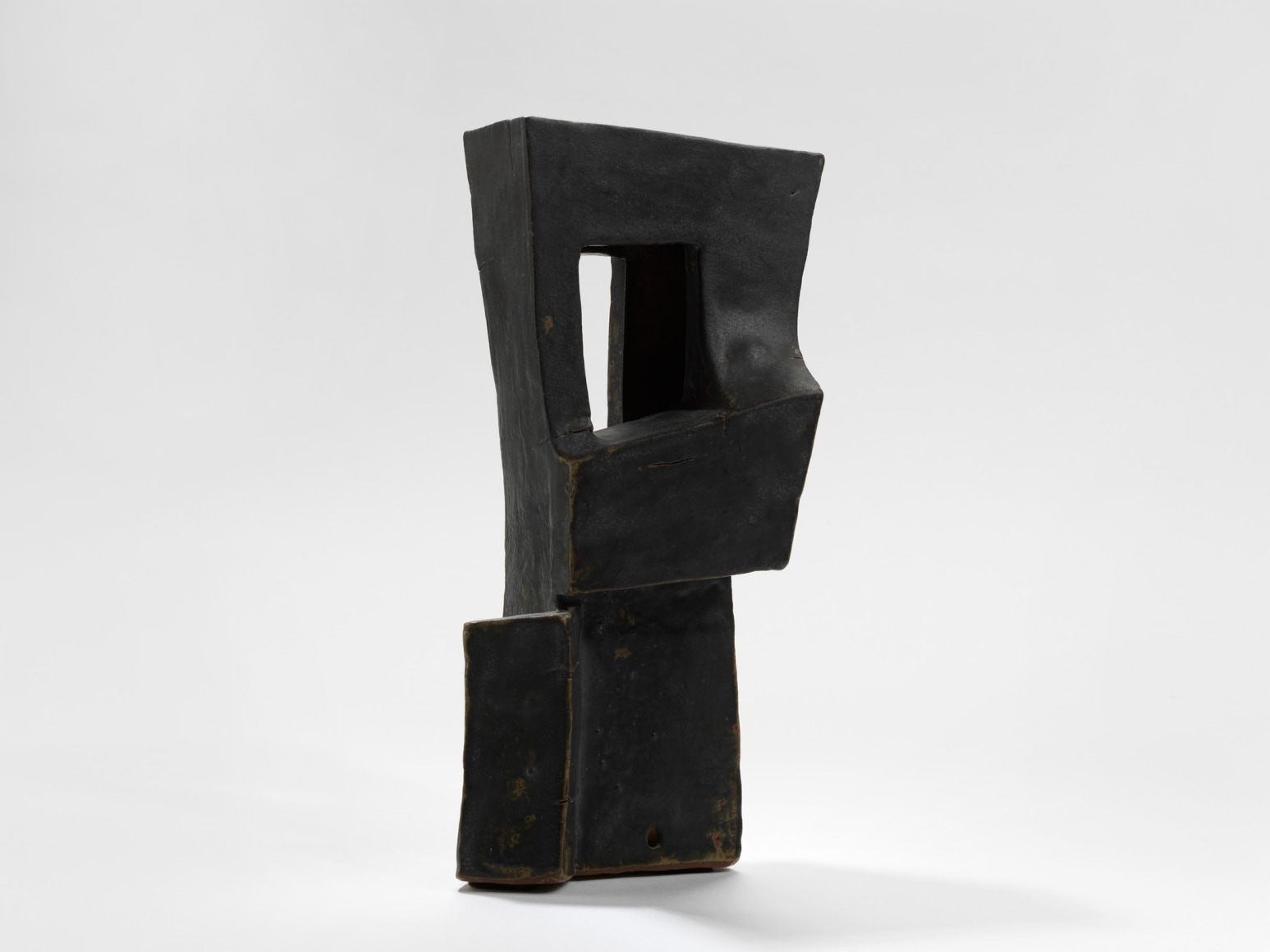 photo of geometric sculpture in a blank room