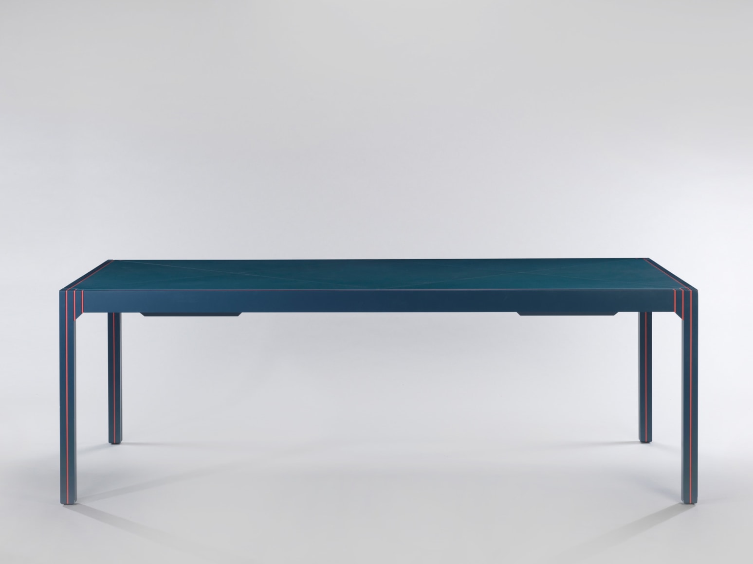 Blue lacquered desk with orange detailing by Pierre Paulin