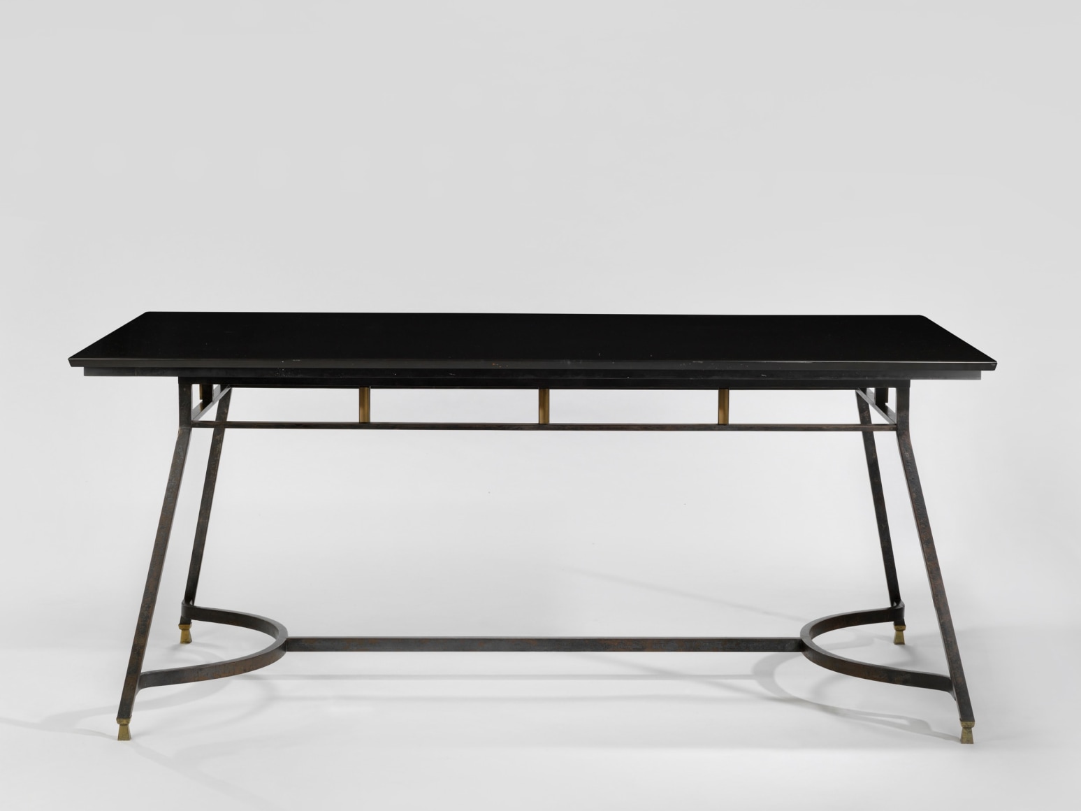 photograph of a black table in a blank room