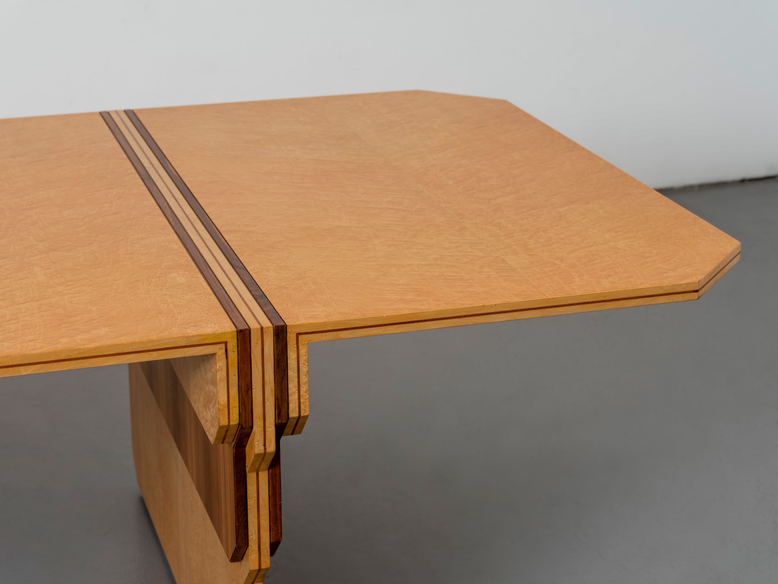 Edge detail of maple and walnut dining table by Pierre Paulin
