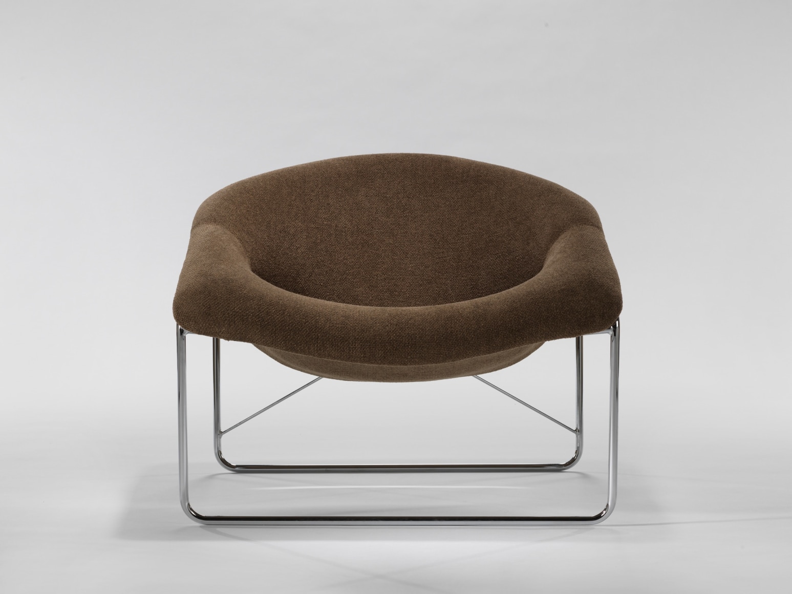 brown modern chair in an empty room