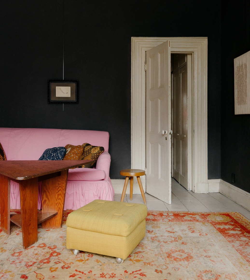 A Frank Lloyd Wright table and stool by Charlotte Perriand in the living room. On the wall left, a drawing by C&eacute;sar. On the right, a work by Sheila Hicks. (Photo: William Jess Laird)