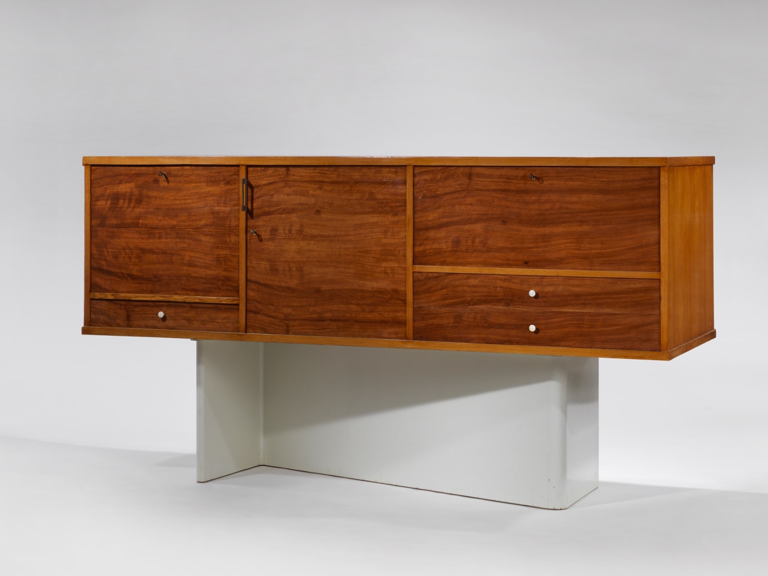 Jacques Dumond Secretary made of wood and hardware photographed with compartments shut.