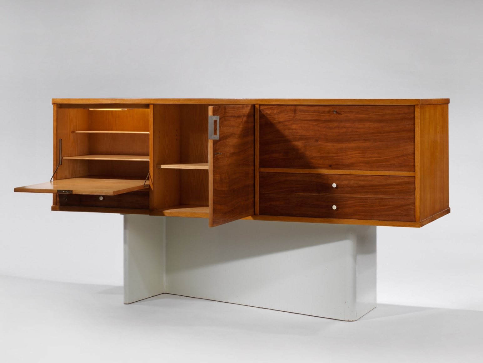 Jacques Dumond Secretary made of wood and hardware photographed with compartments opened and shut.