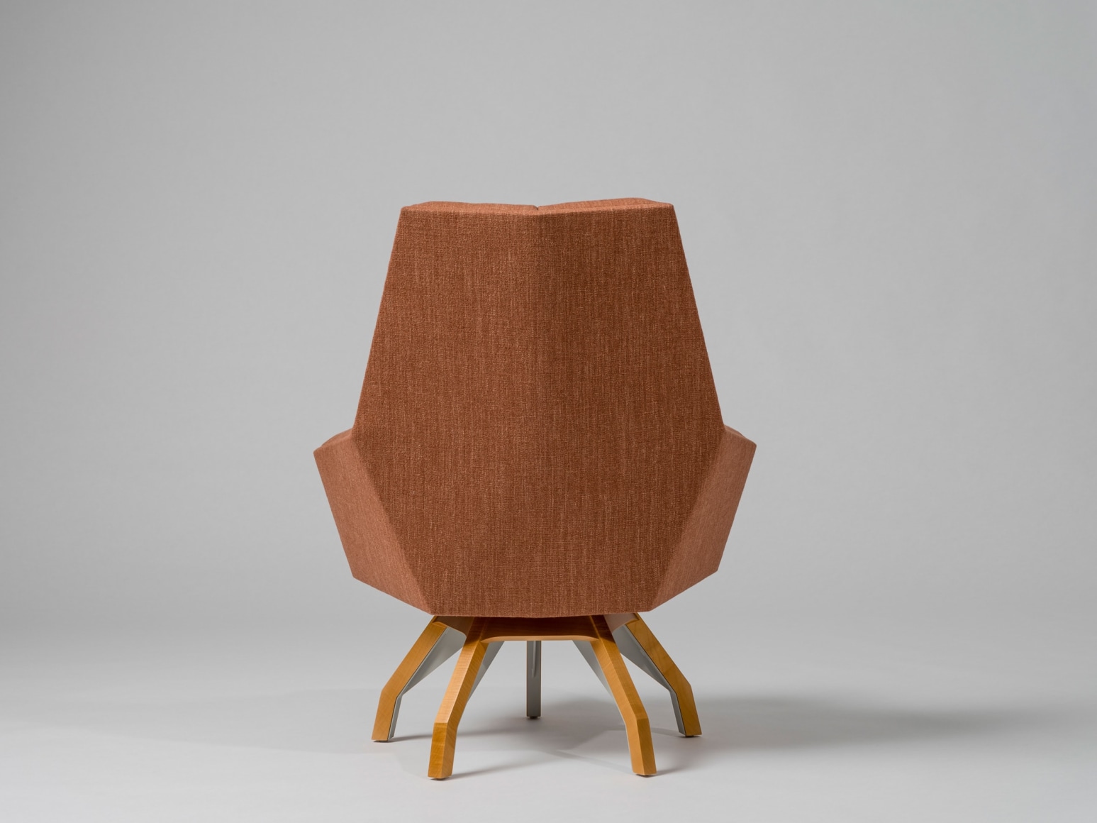Back view of wood based upholstered lounge chair by Pierre Paulin