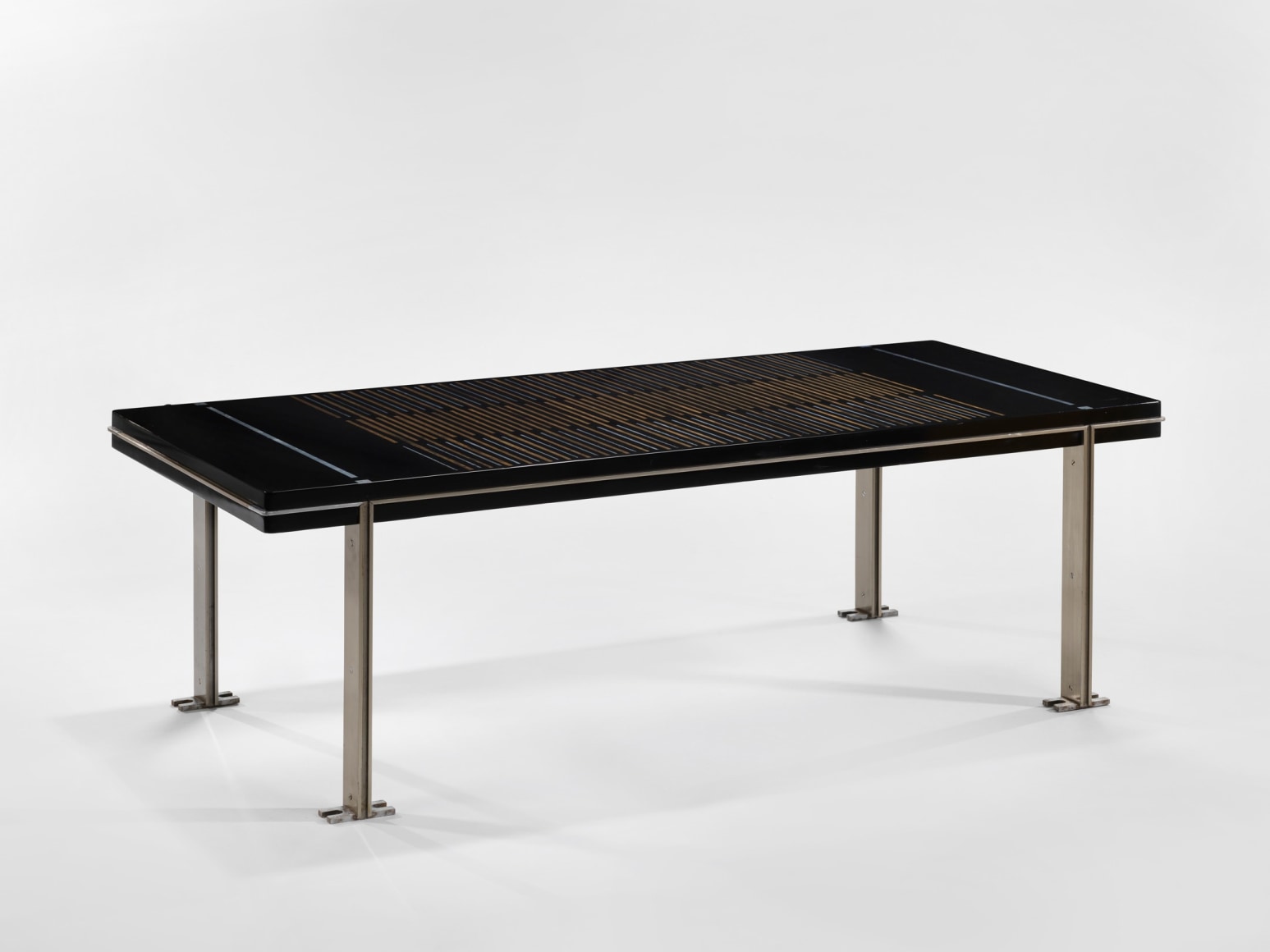 photograph of a black table in a blank room