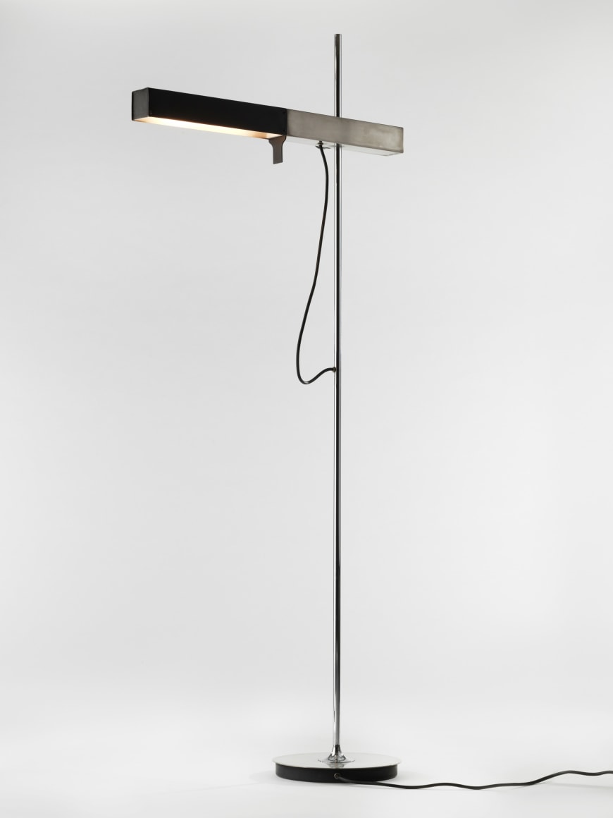 photograph of a floor lamp in a white room